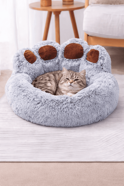 coussin chats ultra confortable en forme de patte avec chat endormi