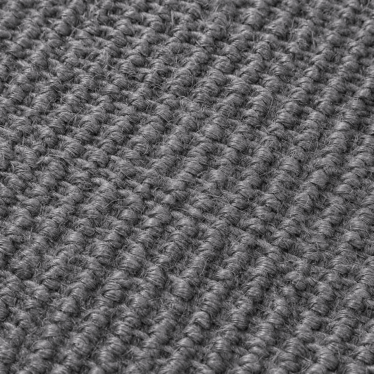 Gros plan de la texture en sisal du griffoir design pour chat