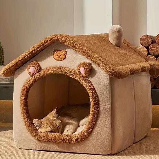 gros chat endormi dedans niche pour chat brune
